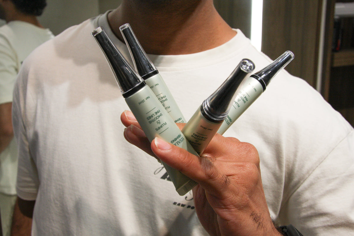 Three UnWrinkled firming serums held in one hand