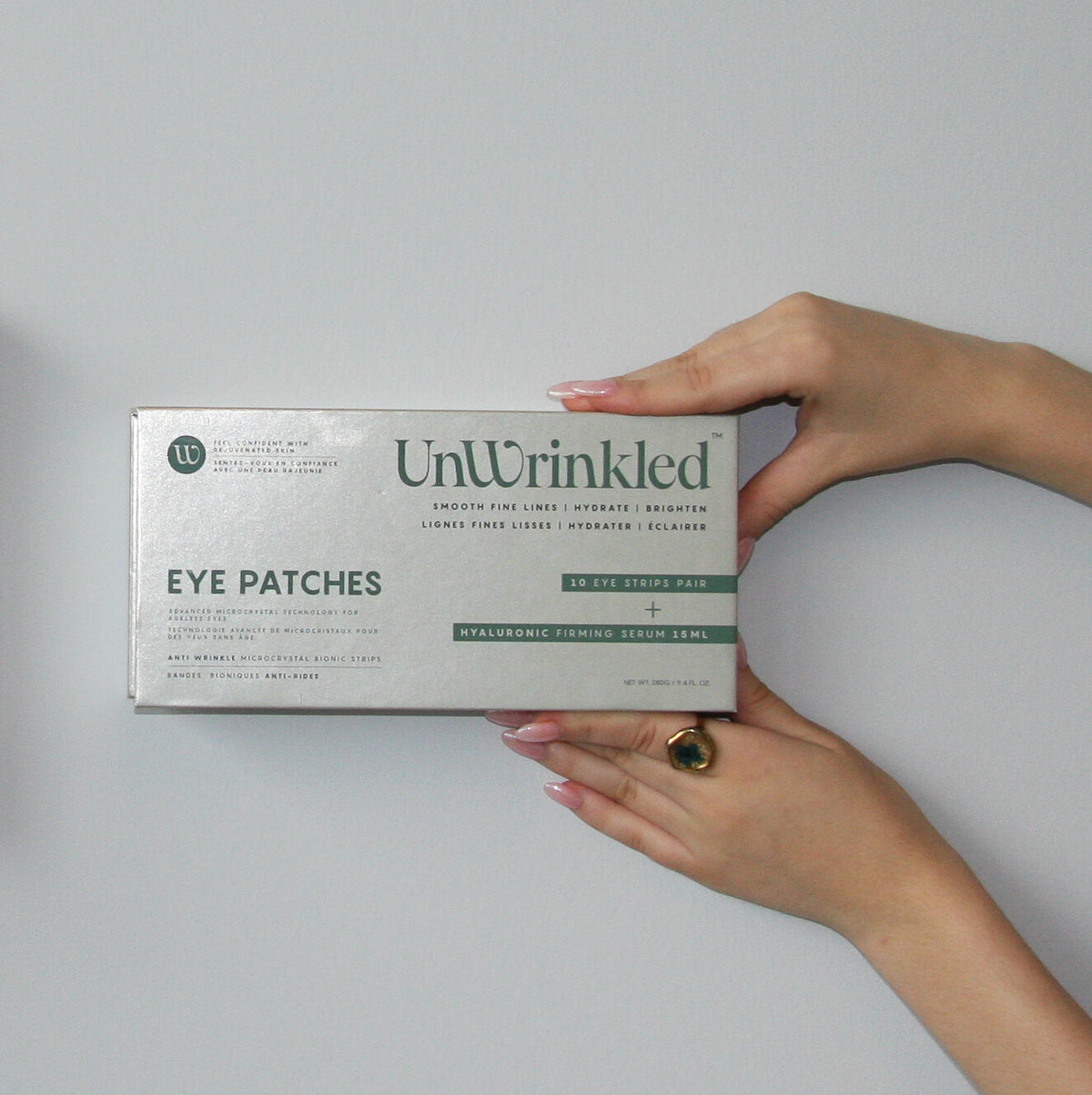 UnWrinkled Eye Patches box held in both hands