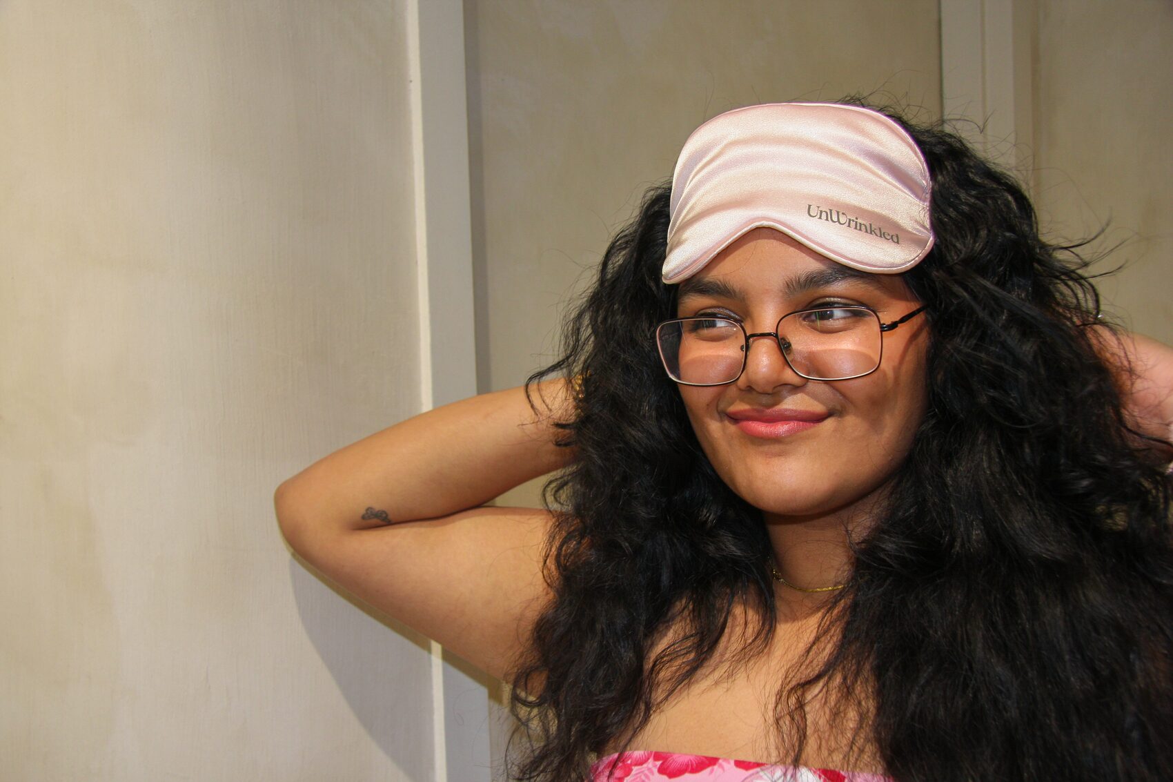 Curls and a silk mask, arm raised