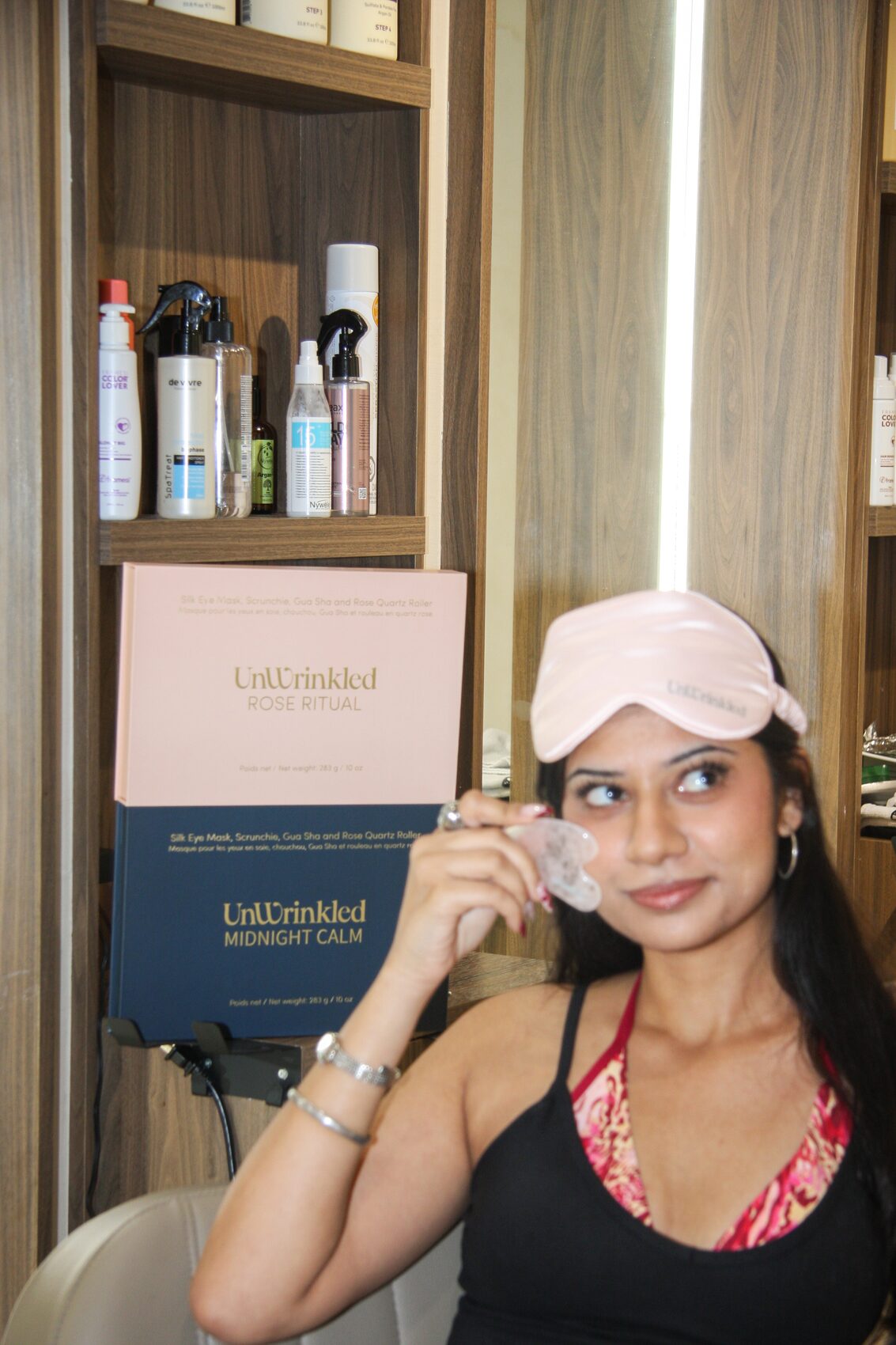Gua sha in hand beside the Midnight Calm box
