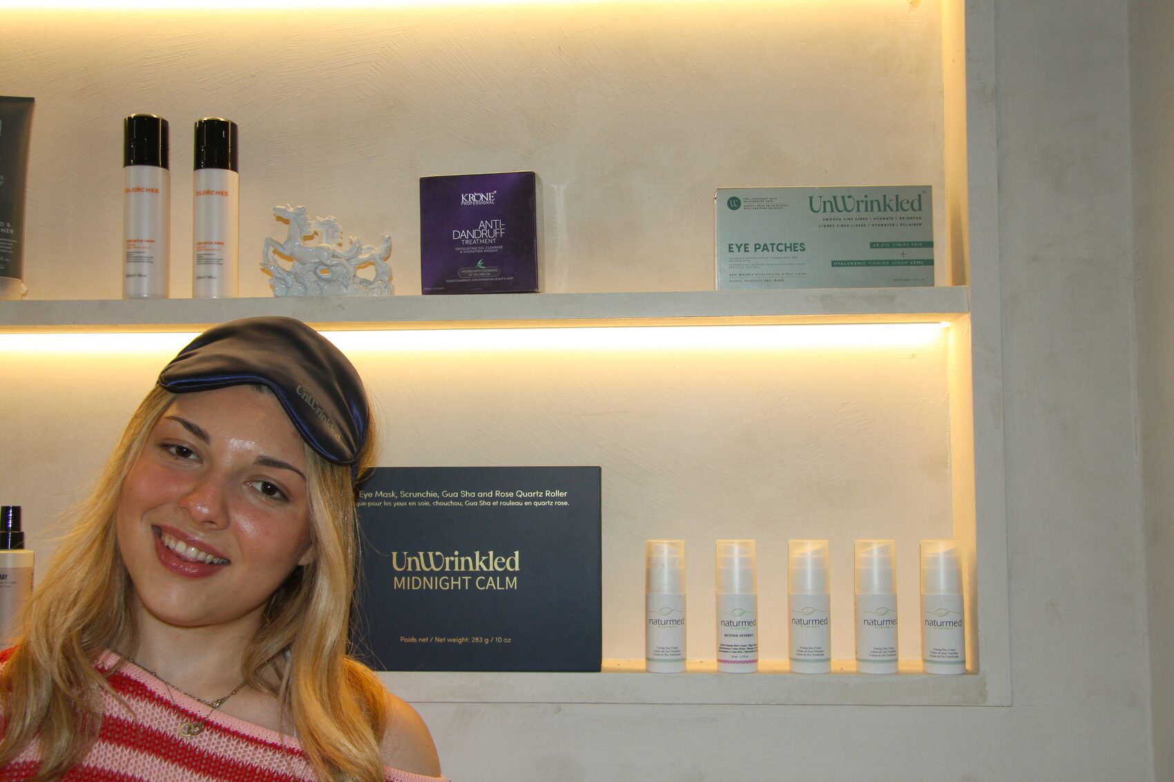 At the retail shelf in a silk eye mask