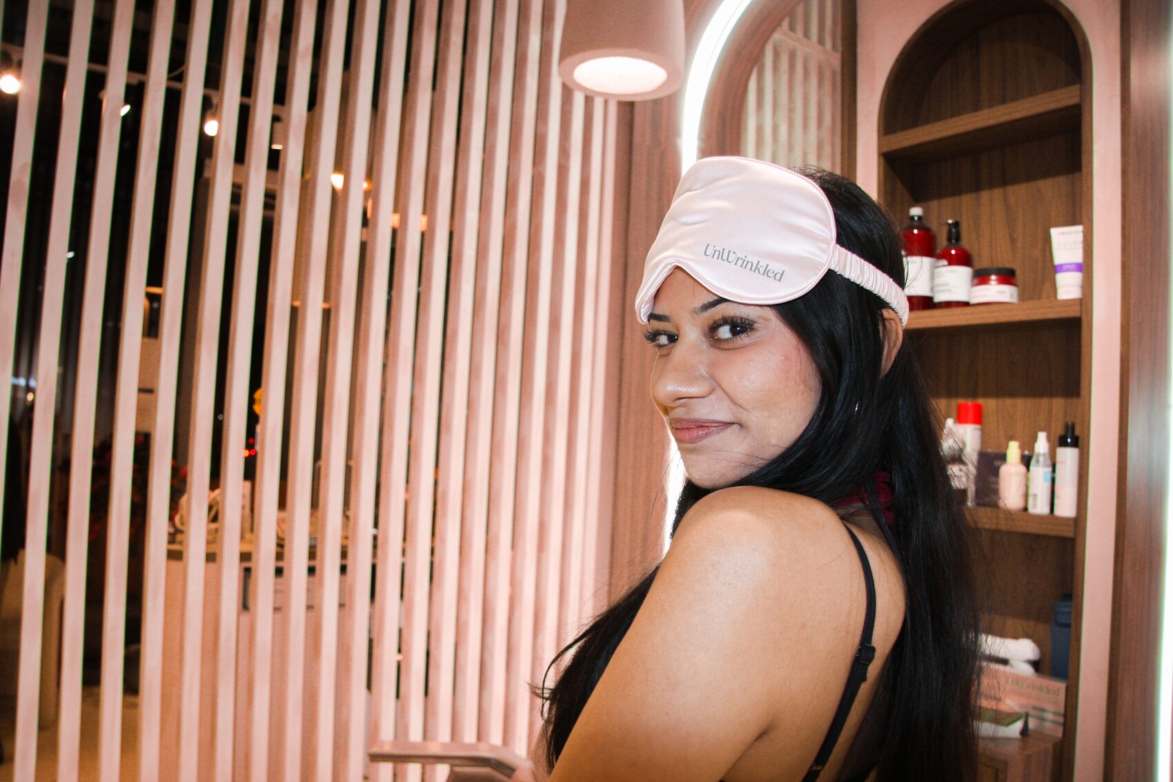 UnWrinkled — silk eye mask against the salon slat wall